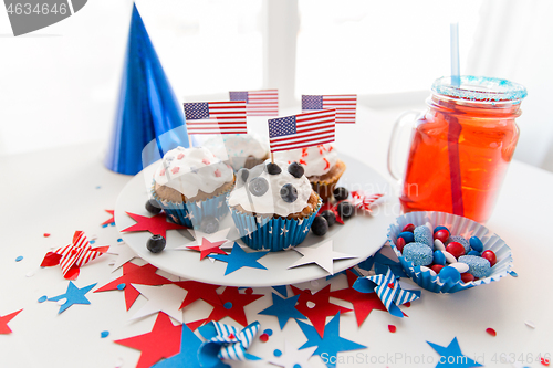 Image of cupcakes with american flags on independence day