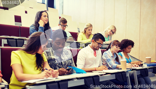 Image of group of students with smartphone at lecture