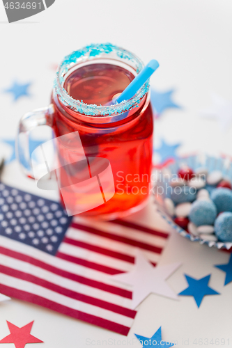 Image of mug of juice and american flag on independence day