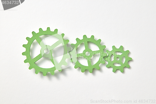 Image of Clockwork mechanism handmade from paper on a white background.