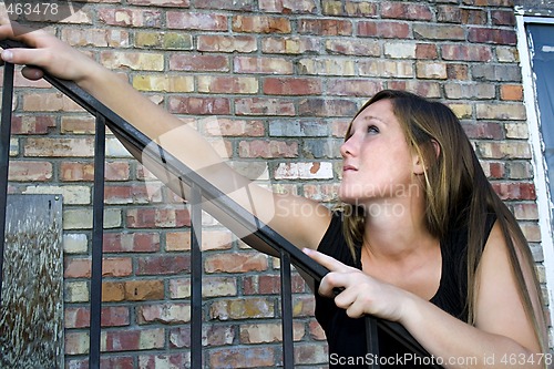 Image of Beautiful Girl posing outdoors on stairs in the City