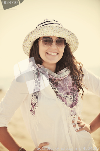 Image of happy young woman on beach