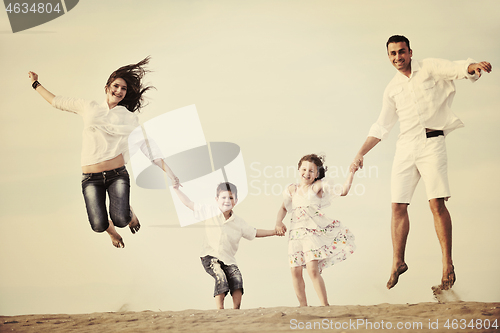 Image of happy young family have fun on beach