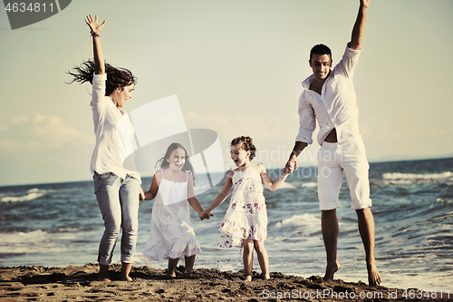 Image of happy young  family have fun on beach