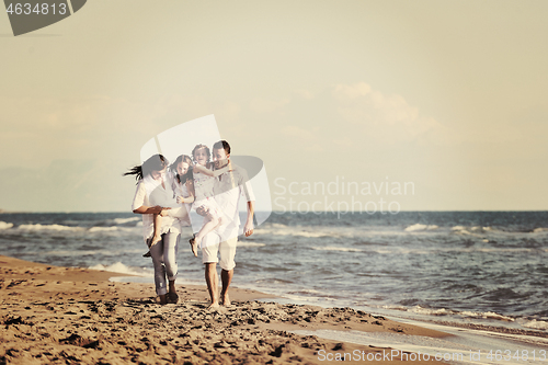 Image of happy young  family have fun on beach