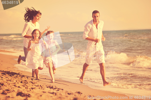 Image of happy young  family have fun on beach