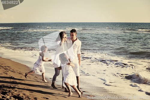 Image of happy young  family have fun on beach