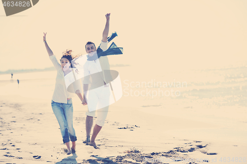 Image of happy young couple have fun at beautiful beach