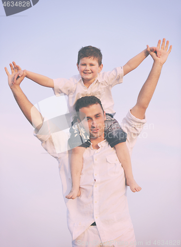 Image of happy young family have fun on beach