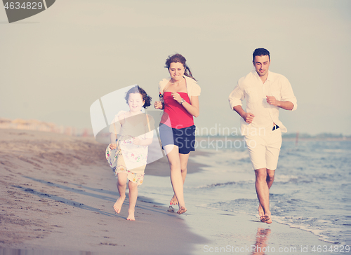 Image of happy young family have fun on beach