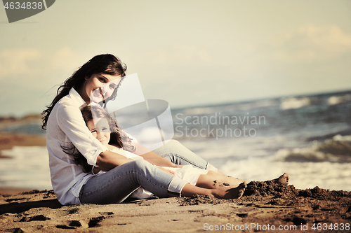 Image of mom and daughter portrait on beach