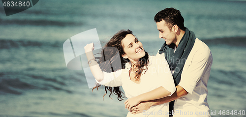 Image of happy young couple have fun at beautiful beach