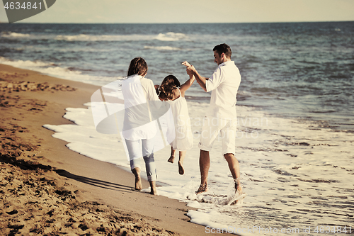 Image of happy young  family have fun on beach