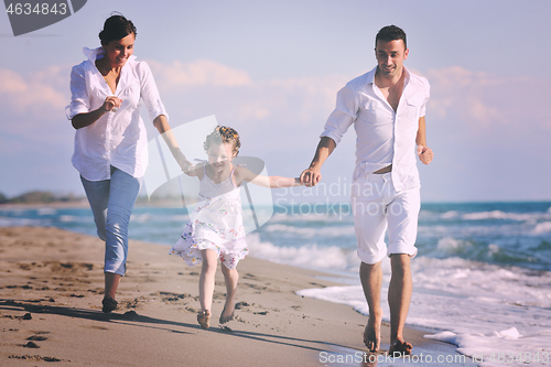 Image of happy young  family have fun on beach