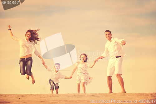 Image of happy young family have fun on beach