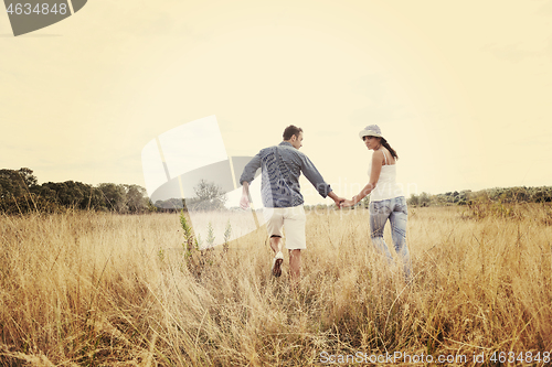 Image of happy young couple have romantic time outdoor