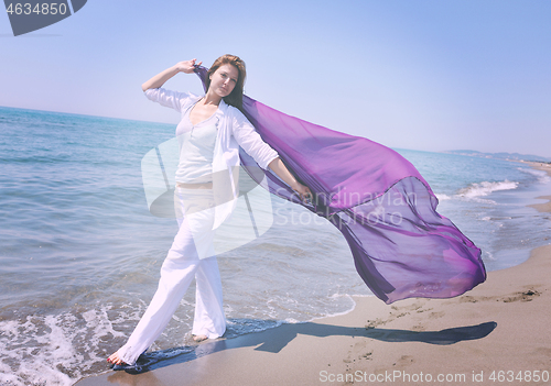 Image of young woman relax  on beach