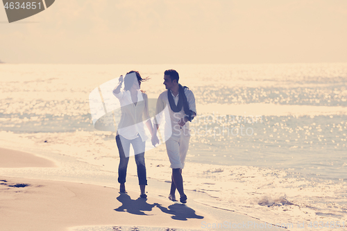 Image of happy young couple have fun at beautiful beach