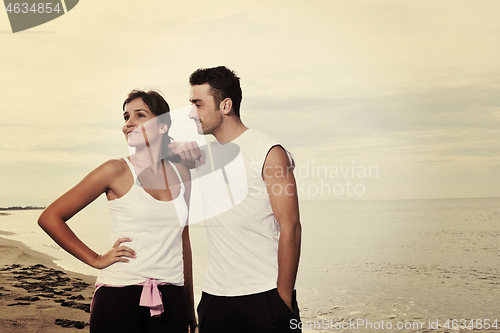 Image of happy young couple have fun at beautiful beach
