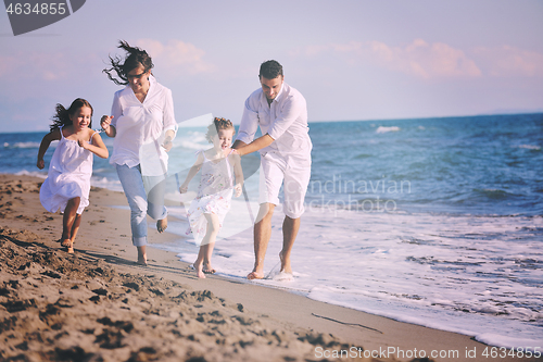 Image of happy young  family have fun on beach