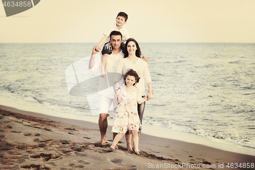 Image of happy young family have fun on beach