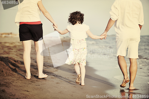 Image of happy young family have fun on beach
