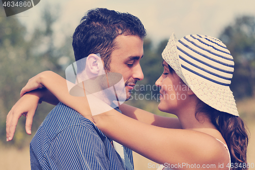 Image of happy young couple have romantic time outdoor