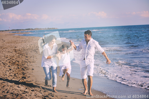 Image of happy young  family have fun on beach