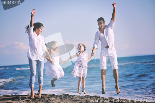 Image of happy young  family have fun on beach