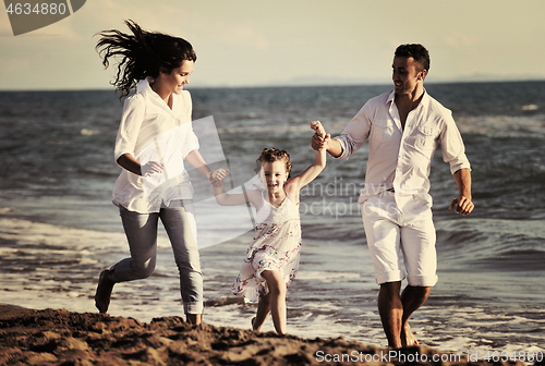 Image of happy young  family have fun on beach