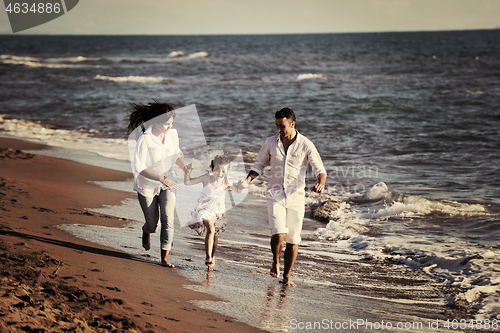 Image of happy young  family have fun on beach