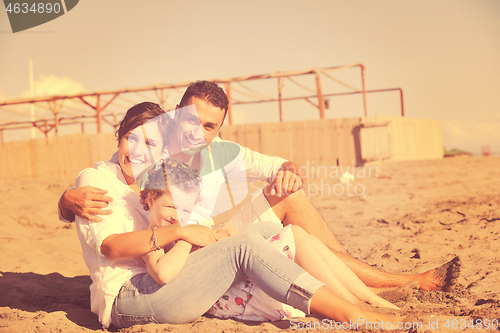 Image of happy young  family have fun on beach