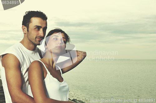 Image of happy young couple have fun at beautiful beach
