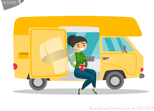 Image of Caucasian white woman drinking coffee in motorhome