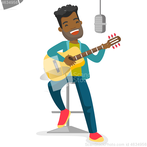 Image of Woman singing in microphone and playing guitar.