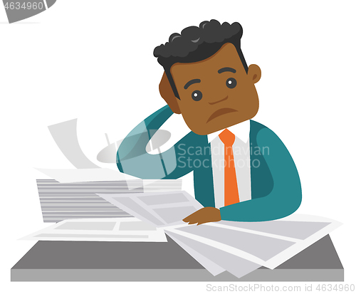 Image of African businessman having a lot of paperwork.