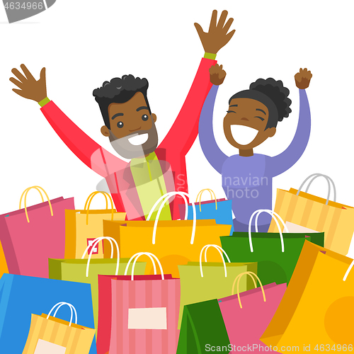 Image of Young african couple sitting among shopping bags.