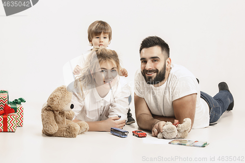 Image of happy family with kid together and smiling at camera isolated on white