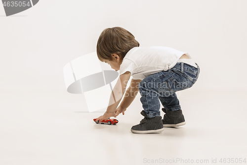 Image of Portrait of happy little boy over white background