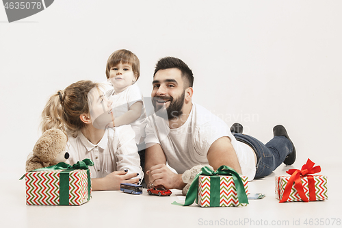 Image of happy family with kid together and smiling at camera isolated on white