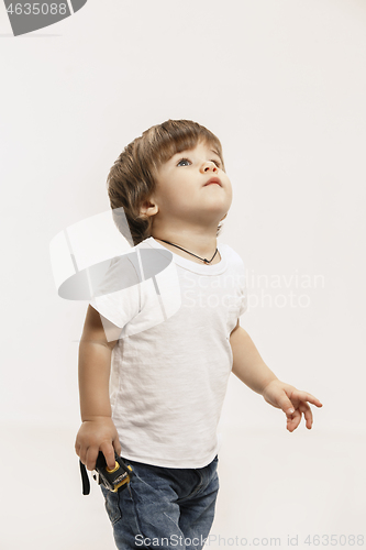 Image of Portrait of happy little boy over white background