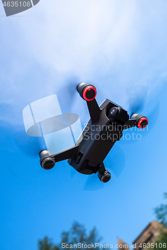 Image of toy drone blue sky background 