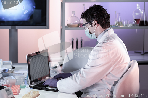 Image of Scientist working in corona virus vaccine development laboratory research facility.