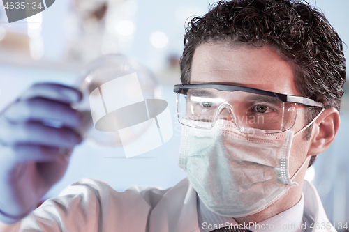 Image of Scientist working in corona virus vaccine development laboratory research facility.