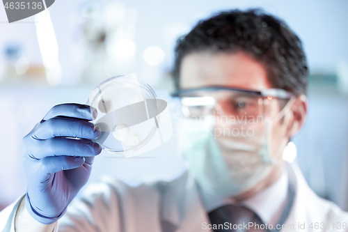 Image of Scientist working in corona virus vaccine development laboratory research facility.