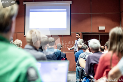 Image of Business speaker giving a talk at business conference meeting event.