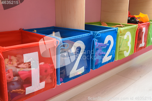 Image of multi-colored boxes with numbers filled with little things