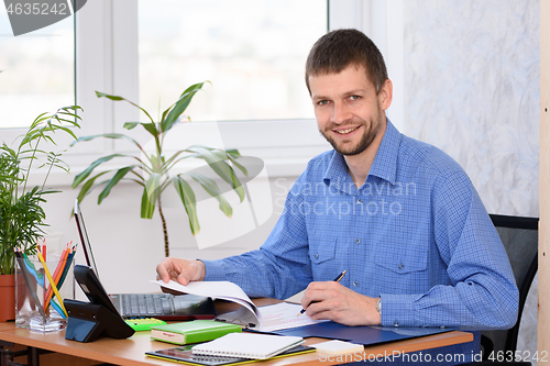 Image of Portrait of a successful office clerk in the workplace
