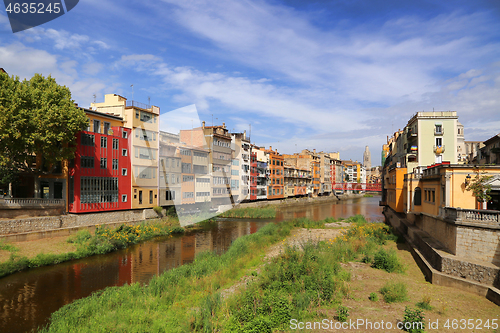 Image of Colorful houses and Eiffel bridge and river Onyar in Girona