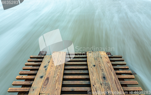 Image of Broken pier and surf washed out with long exposure